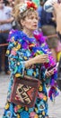 2018: Older lady wearing colorful feathers attending Gay Pride parade also known as Christopher Street Day CSD in Munich
