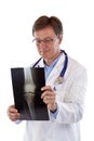 Older male senior doctor looks at x-ray image