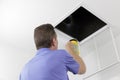 Man Inspecting an Air Duct with a Flashlight Royalty Free Stock Photo