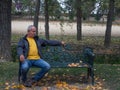 Older man alone sitting on a park bench. Loneliness concept Royalty Free Stock Photo