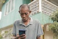 An older man amazed at seeing a sexy picture or an interesting social media post on his cellphone. Making an inadvertently funny