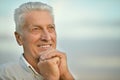 Older man on background of the sky Royalty Free Stock Photo