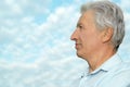 Older man on background of the sky Royalty Free Stock Photo