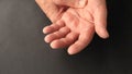 Older man has finger tremors