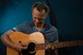 Older Man having fun playing his acoustic guitar Royalty Free Stock Photo