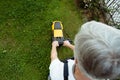 Older man mowing the lawn Royalty Free Stock Photo