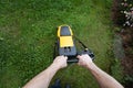 Older man mowing the lawn Royalty Free Stock Photo