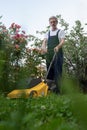 Older man mowing the lawn Royalty Free Stock Photo