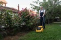 Older man mowing the lawn Royalty Free Stock Photo