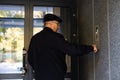 Older man repairing intercom in the apartment Royalty Free Stock Photo