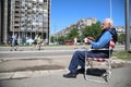 Older man is sitting in a chair and giving support to the racers