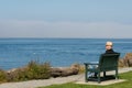 Older Man Sitting Looking Out to Sea Royalty Free Stock Photo