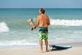 An Older Man with Surf Board