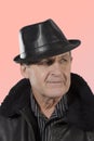 Older man wearing leather hat, jacket Royalty Free Stock Photo