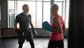 Older man and woman boxing in gym Royalty Free Stock Photo