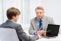 Older man and young man with laptop computer Royalty Free Stock Photo