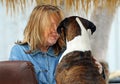 Older mature woman and her best friend dog hugging & talking Royalty Free Stock Photo