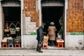 Older people buy food at a street store in Lisbon, Portugal. Royalty Free Stock Photo