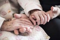 Older people shaking hands at home