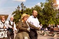 Older people spend their leisure time dancing in the square