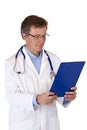 Older Senior doctor reading patient record