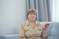 Older smiled lady and her new smartphone Royalty Free Stock Photo