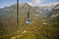 Older style ski lift on Velika Planina, Slovenia. Mountain cottage hut or house on idyllic hill Velika planina.