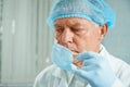 Older surgeon takes off his protective mask Royalty Free Stock Photo