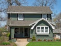 Older Two Story Home with Spring Flowers Royalty Free Stock Photo