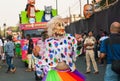 Older woman actor dancing outdoor in crowd of the traditional indian carnival