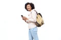 Older woman with bag and mobile phone against isolated white background Royalty Free Stock Photo