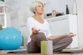 older woman doing yoga at home or gym Royalty Free Stock Photo