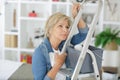 older woman evaluating redecorating work