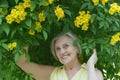 Older woman with flowers Royalty Free Stock Photo