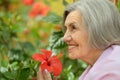 Older woman with flowers Royalty Free Stock Photo