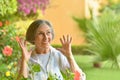 Older woman with flowers Royalty Free Stock Photo