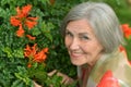 Older woman with flowers Royalty Free Stock Photo