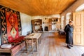 Older woman inside the house-museum of famous Georgian painter Niko Pirosmani in village where he lived last years