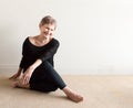 Older woman laughing doing yoga