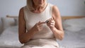 Older woman measuring glucose level, lancet pen on finger Royalty Free Stock Photo