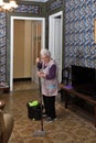 Older woman with mop making the floor of her house Royalty Free Stock Photo