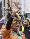2019: A an older woman in an ornage costume attending the Gay Pride parade also known as Christopher Street Day CSD in Munich