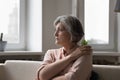 Older woman staring into distance feeling lonely suffers from solitude