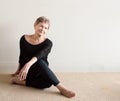 Older woman smiling doing yoga