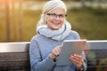 Older woman using digital tablet