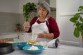 older woman making a cake Royalty Free Stock Photo