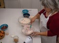 older woman making a cake Royalty Free Stock Photo