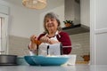 older woman making a cake Royalty Free Stock Photo