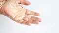 Older womans hand on white background