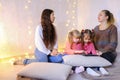 Older women and baby girls four communicate and busy with own af Royalty Free Stock Photo